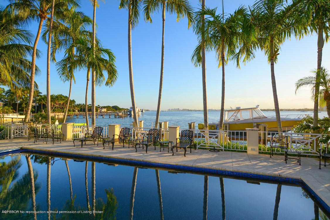 400 Caribbean Road Palm Beach, FL 33480 - Photo 42 of 45 a view of a palm tree with outdoor seating
