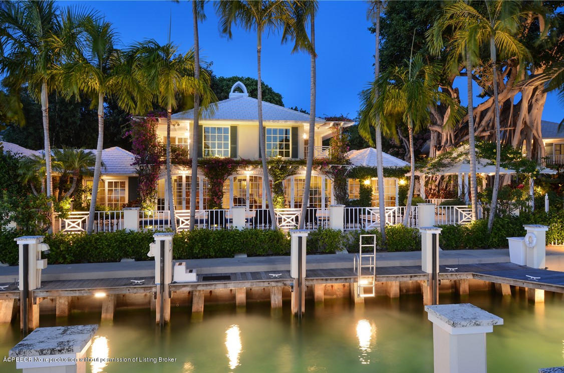 400 Caribbean Road Palm Beach, FL 33480 - Photo 44 of 45 a view of a swimming pool with a table and chairs