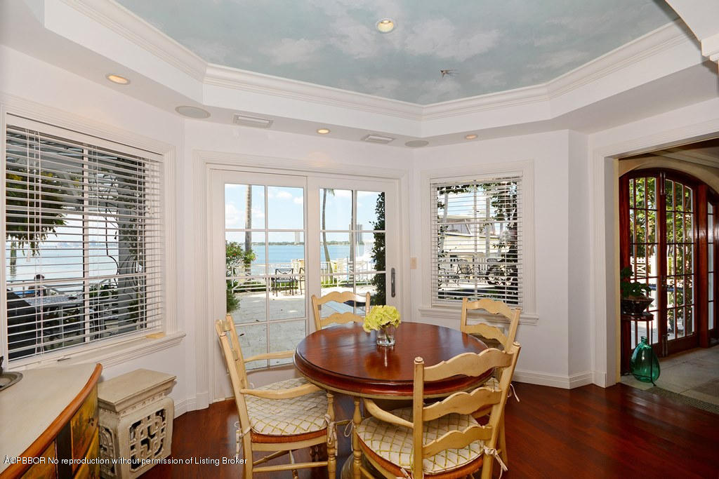 400 Caribbean Road Palm Beach, FL 33480 - Photo 9 of 45 a view of a dining room with furniture window and wooden floor