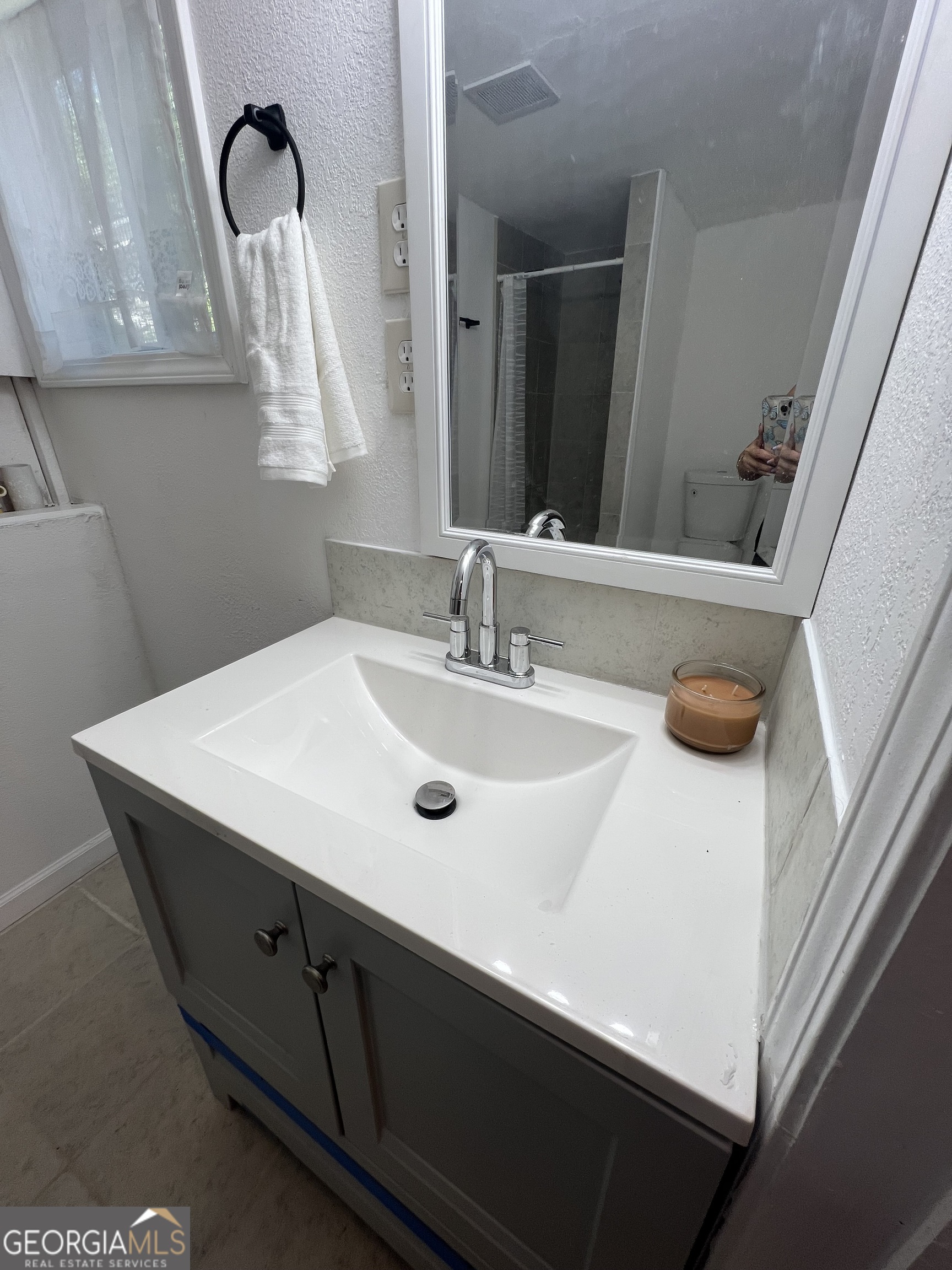 101 McGee Street LaGrange, GA 30241 - Photo 9 of 15 a bathroom with a sink and a mirror