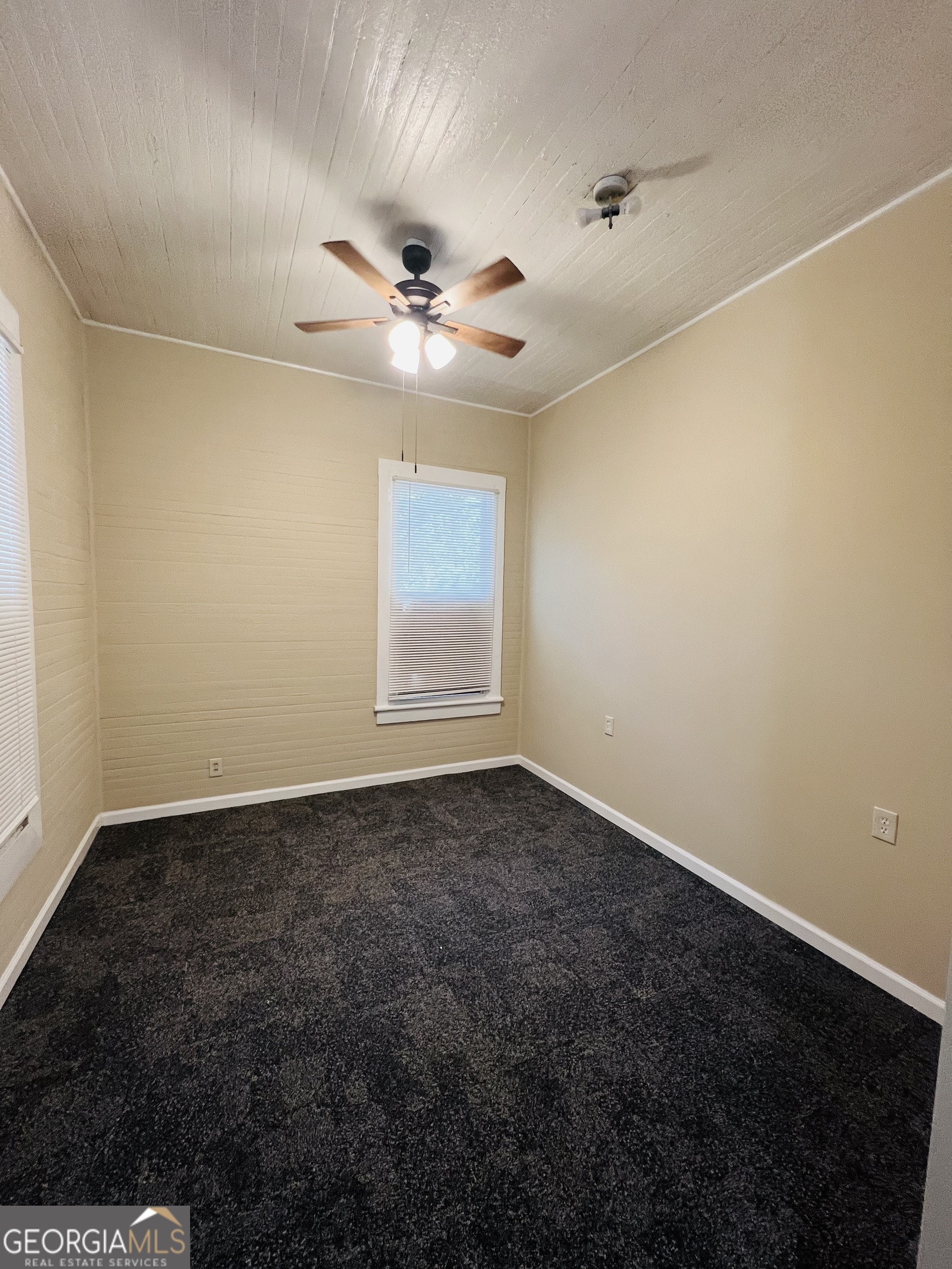 101 McGee Street LaGrange, GA 30241 - Photo 10 of 15 an empty room with a window and ceiling fan