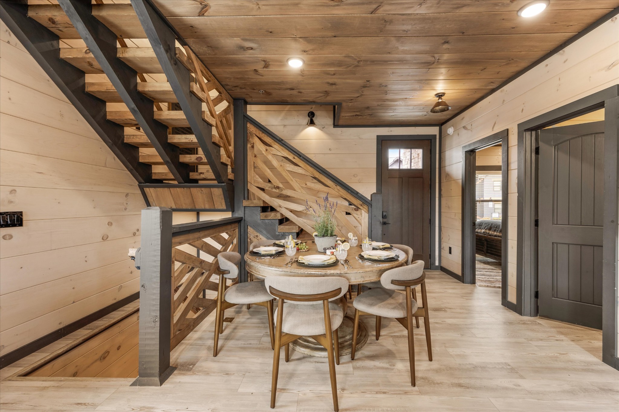 297 Rambling Crk Way Sevierville, TN 37862 - Photo 18 of 84 a view of a dining room with furniture and wooden floor