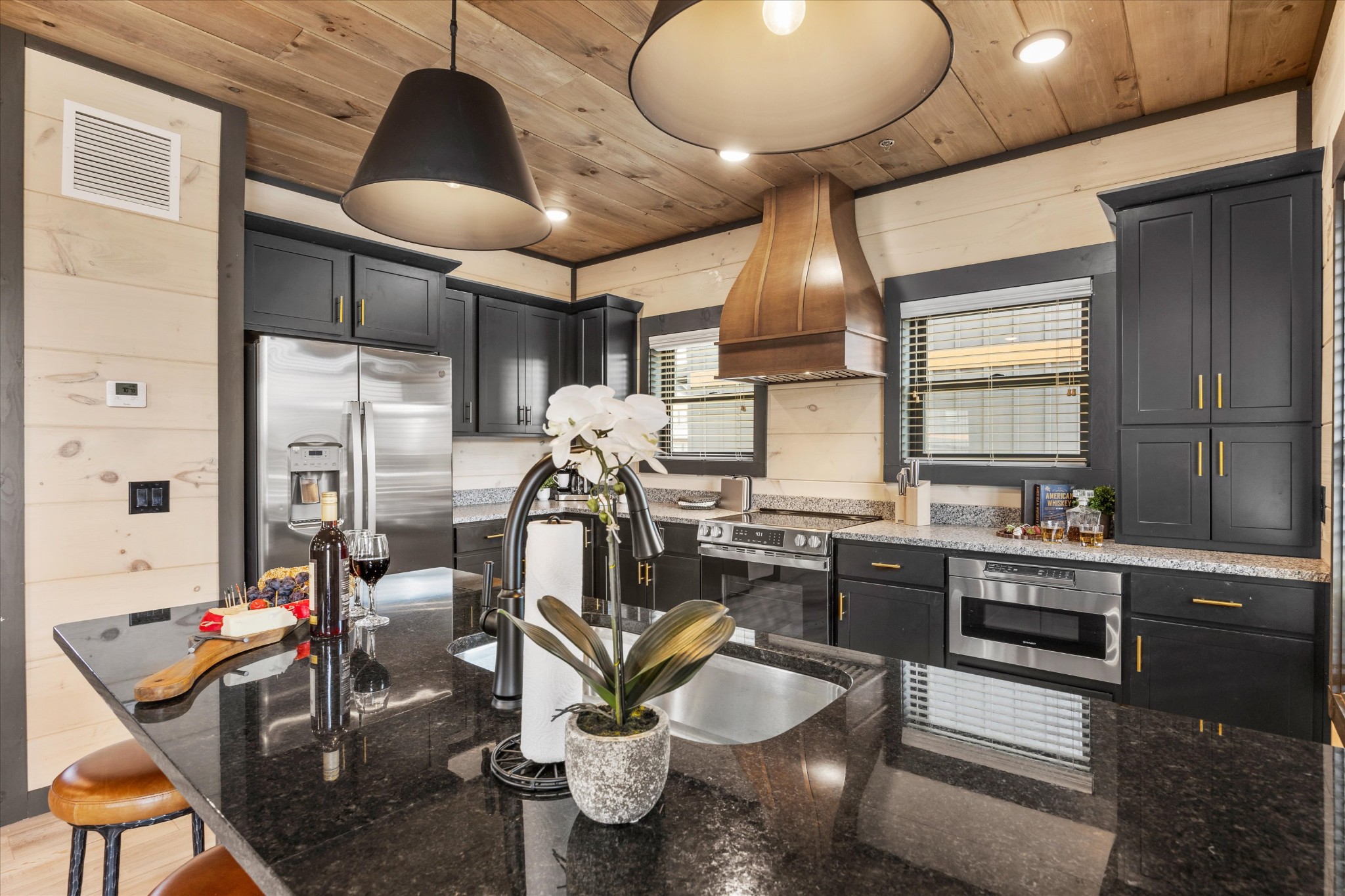 297 Rambling Crk Way Sevierville, TN 37862 - Photo 23 of 84 a kitchen with sink stove and cabinets