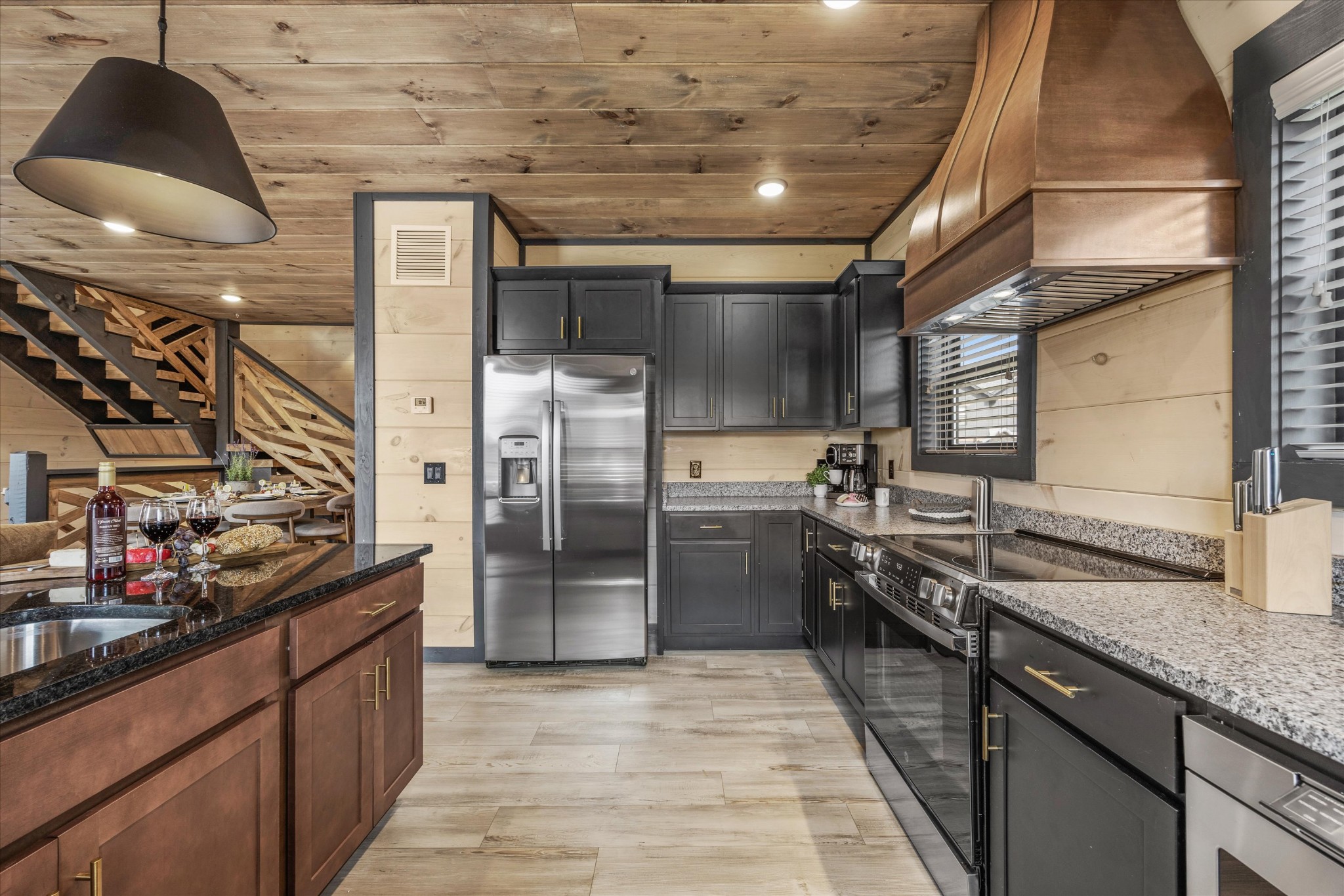 297 Rambling Crk Way Sevierville, TN 37862 - Photo 29 of 84 a kitchen with stainless steel appliances granite countertop a sink and stove