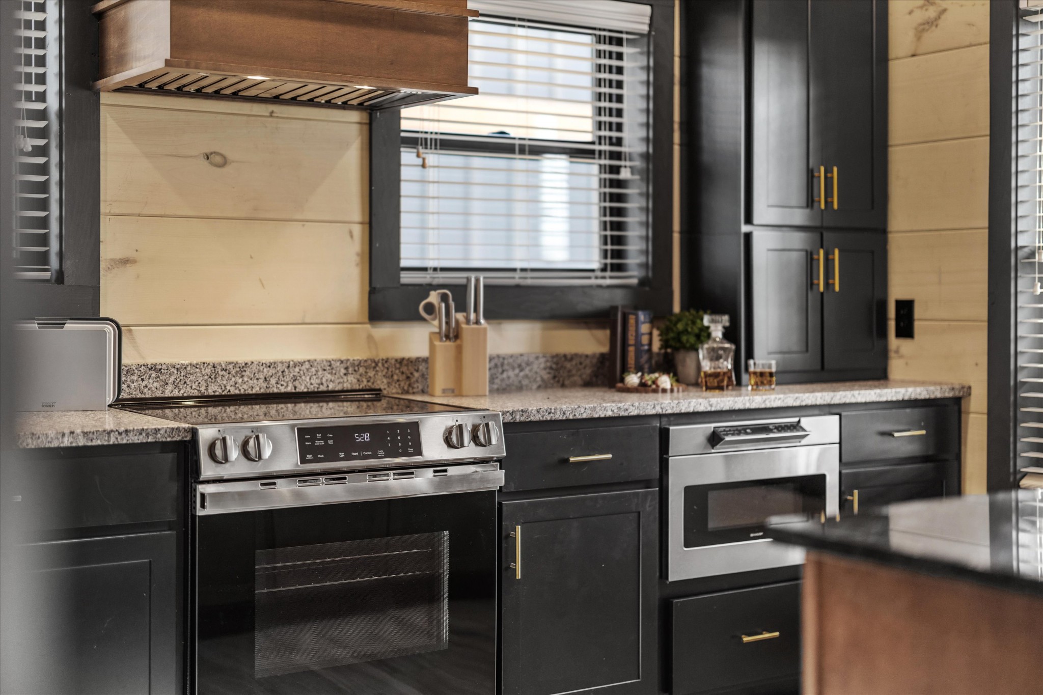 297 Rambling Crk Way Sevierville, TN 37862 - Photo 30 of 84 a kitchen with granite countertop a stove and a sink