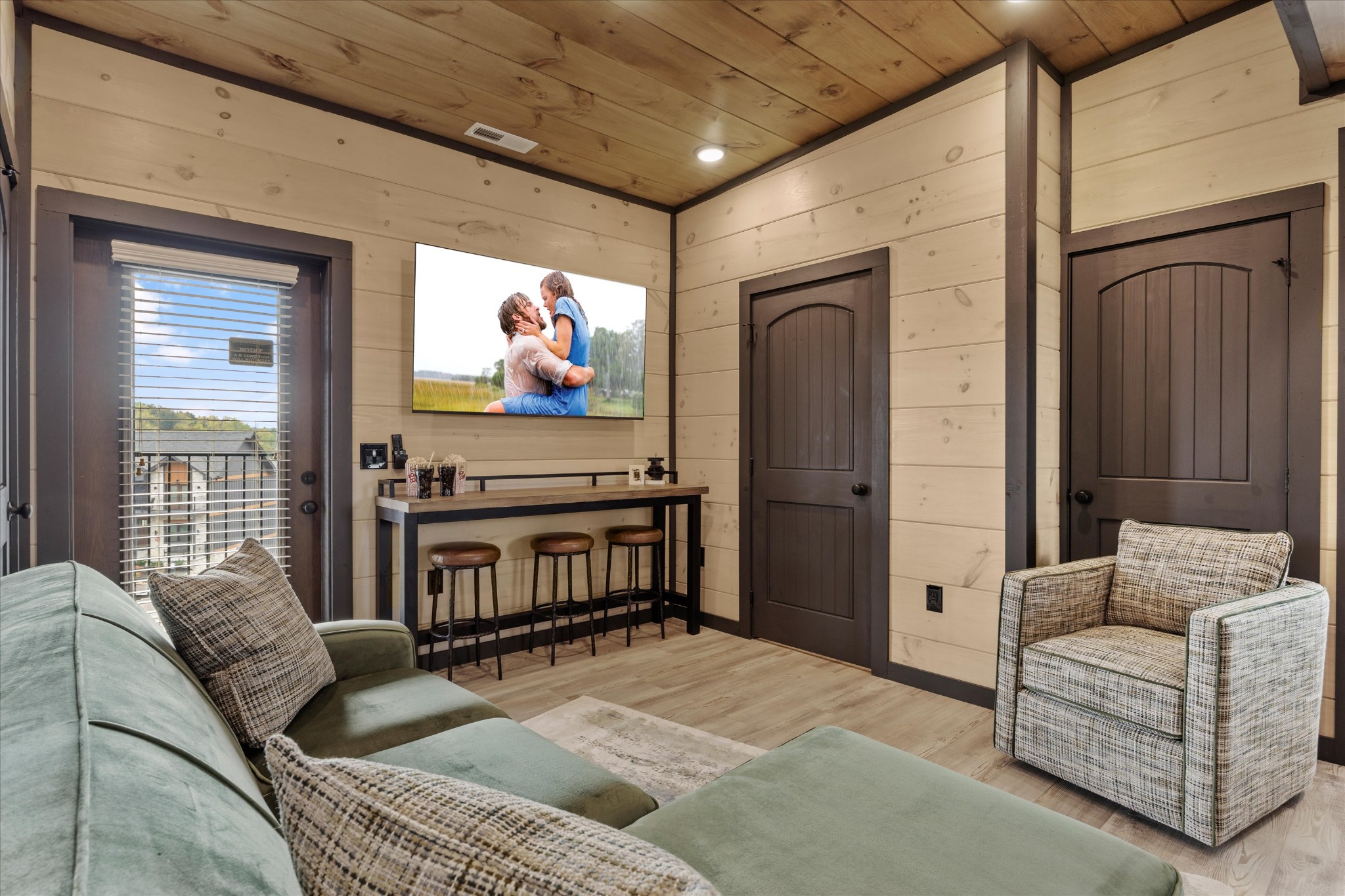 297 Rambling Crk Way Sevierville, TN 37862 - Photo 55 of 84 a living room with furniture a flat screen tv and a window