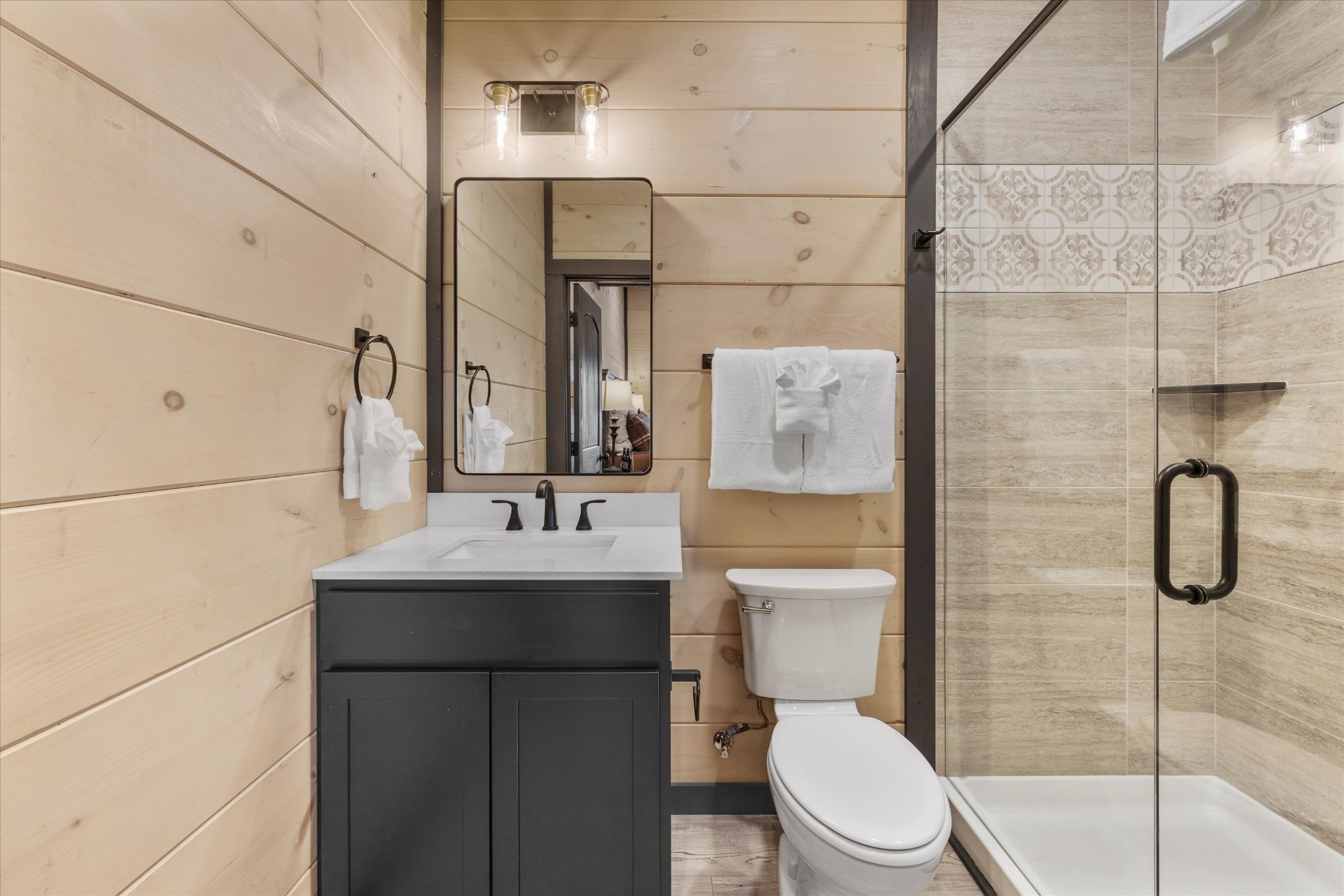 297 Rambling Crk Way Sevierville, TN 37862 - Photo 63 of 84 a bathroom with a toilet sink shower and mirror