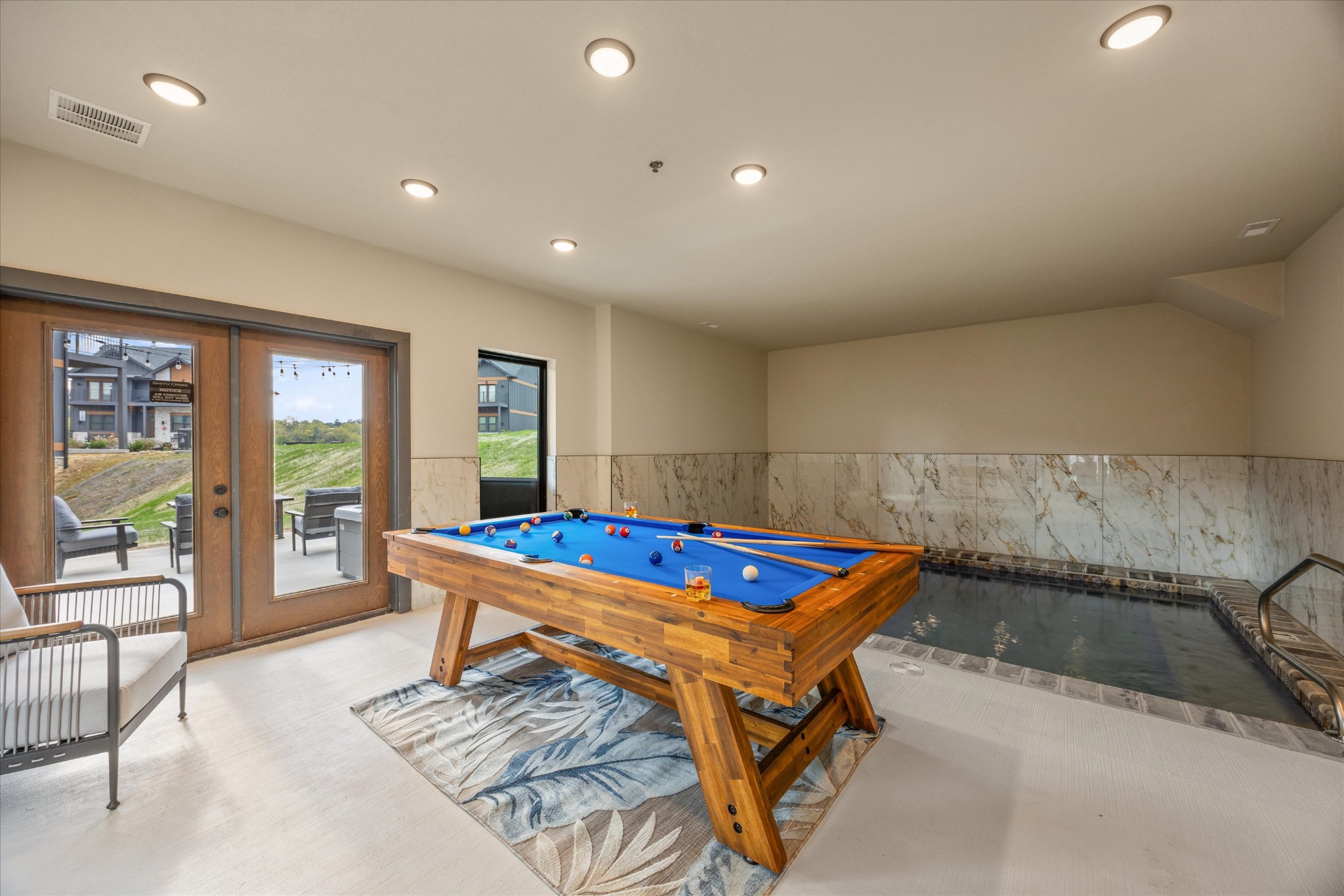 297 Rambling Crk Way Sevierville, TN 37862 - Photo 71 of 84 a living room with furniture pool table and a large window