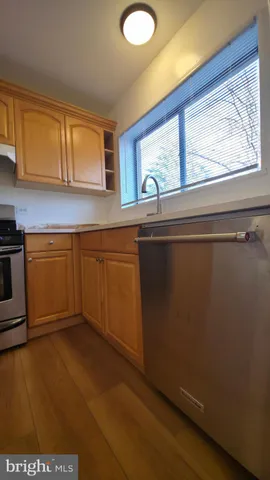 a view of hallway with wooden floor