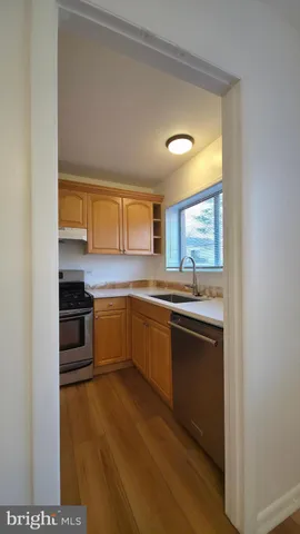 a view of a yard with wooden fence