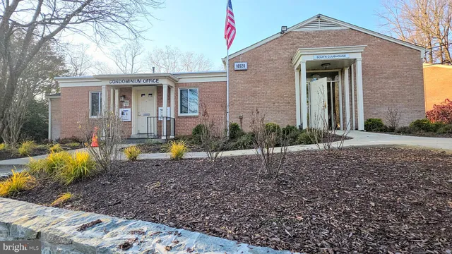 a view of a swimming pool with a patio and a yard