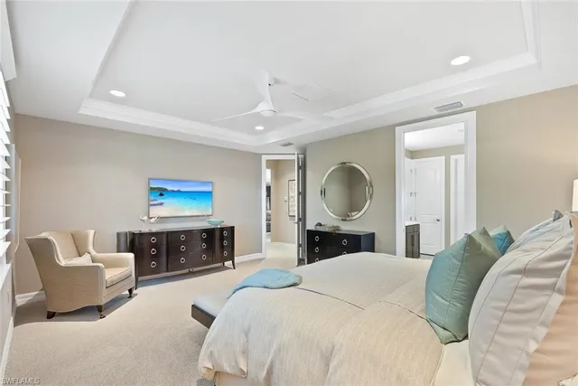 a spacious bathroom with a double vanity sink a toilet and a shower