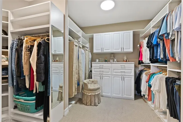 a bed room with bed and a flat tv screen