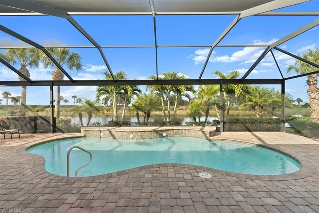 a view of a swimming pool with a patio