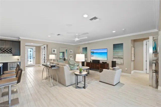 a living room with furniture a rug and a fireplace