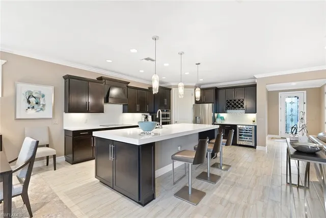 a large kitchen with a table and chairs