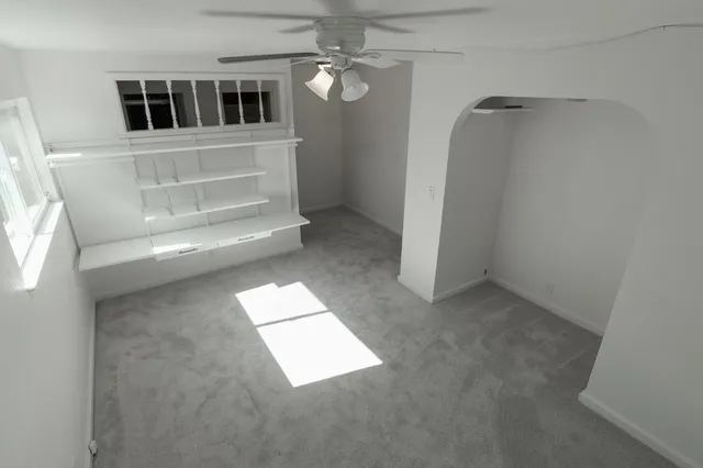 an empty room with windows