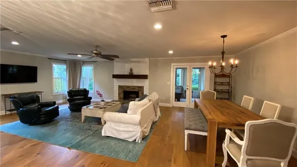 a living room with furniture fireplace and a flat screen tv