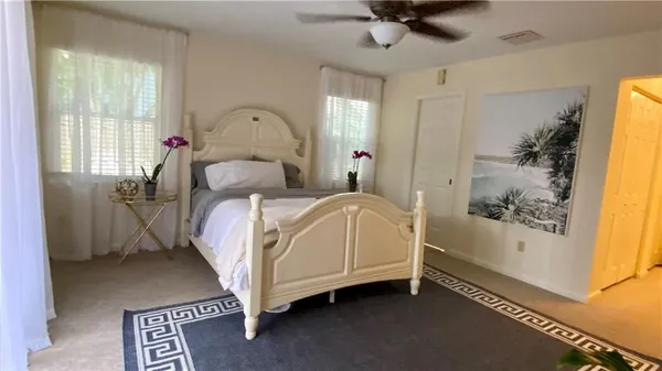 a bed room with a bed and a window