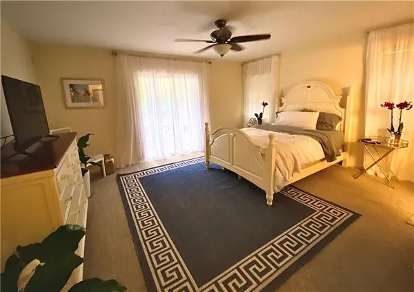 a bed room with a bed and a chandelier