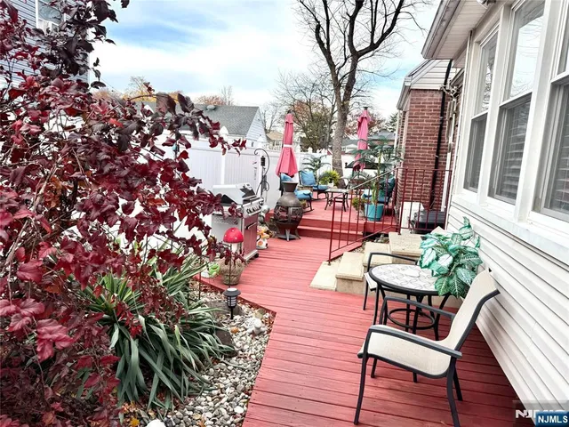 a view of a chairs and tables in patio with plants