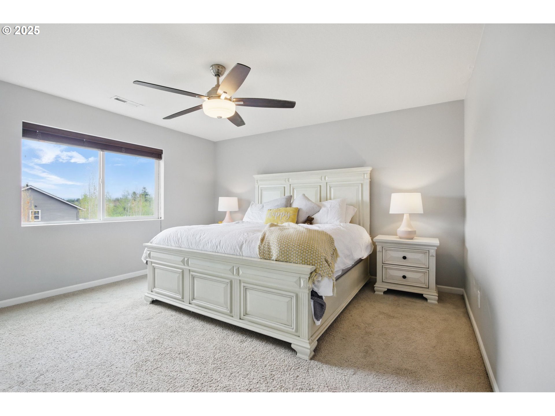 262 North 34th Court Ridgefield, WA 98642 - Photo 15 of 27 a bedroom with a bed and a large window