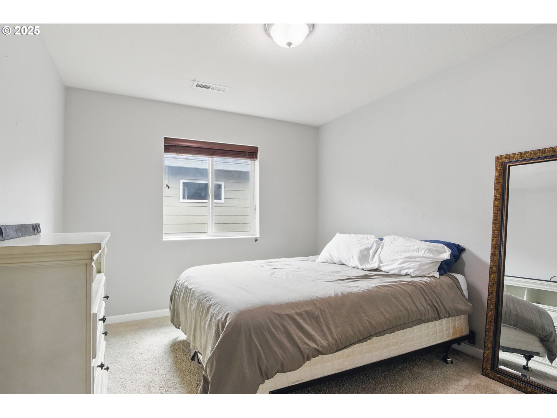 262 North 34th Court Ridgefield, WA 98642 - Photo 17 of 27 a bedroom with a bed and a window