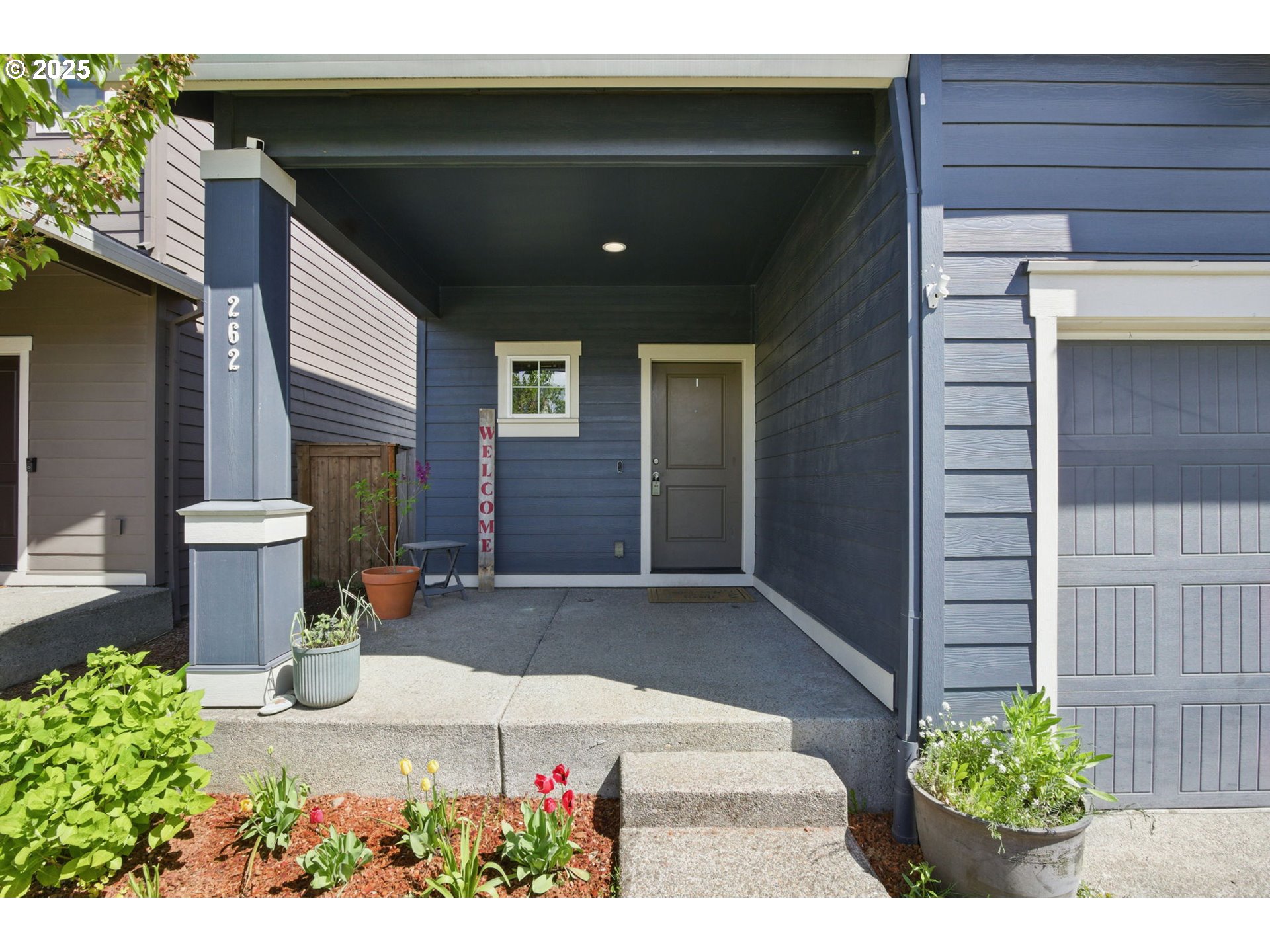262 North 34th Court Ridgefield, WA 98642 - Photo 2 of 27 a front view of a house with a yard