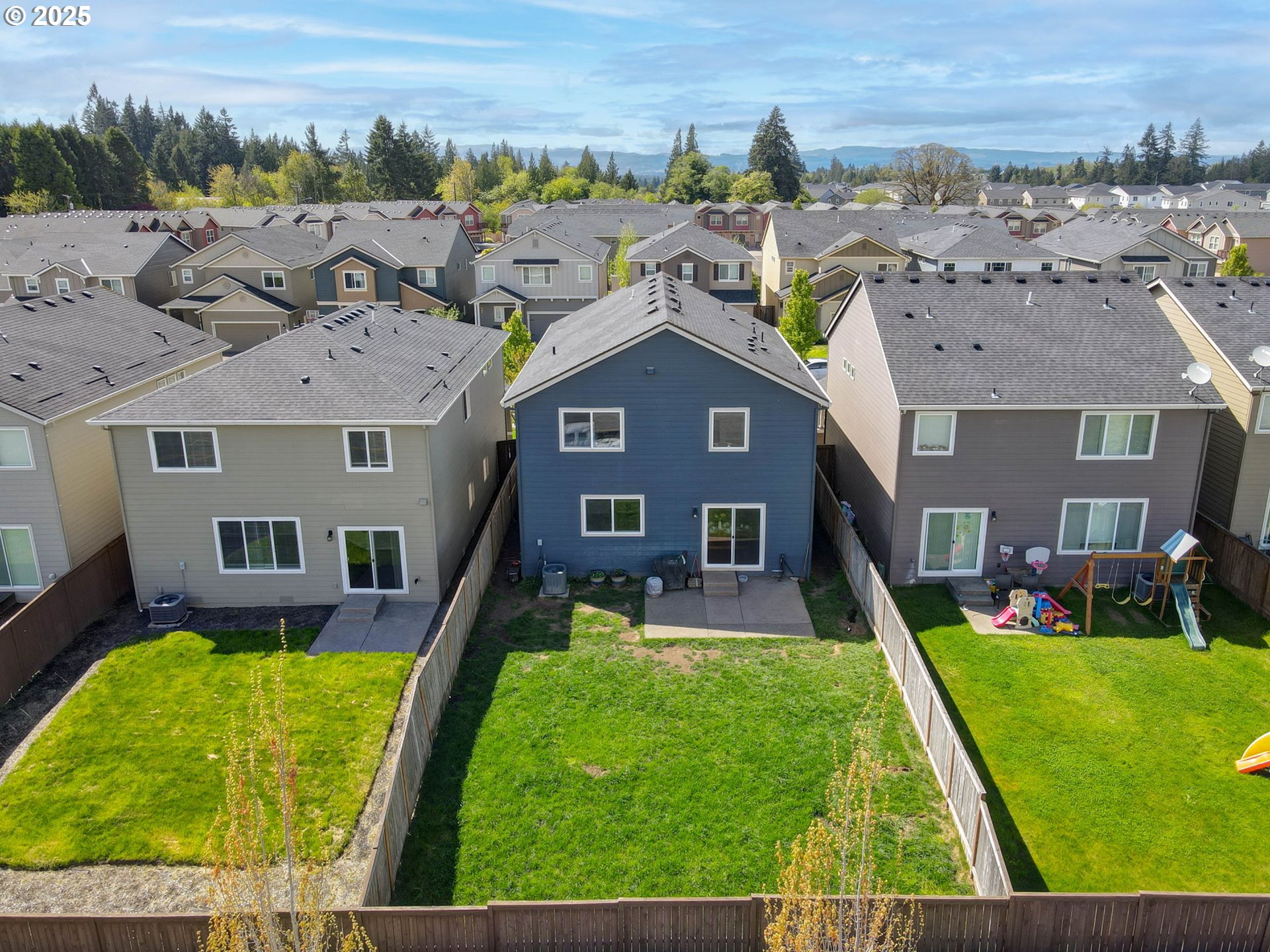 262 North 34th Court Ridgefield, WA 98642 - Photo 25 of 27 aerial view of a house with a yard