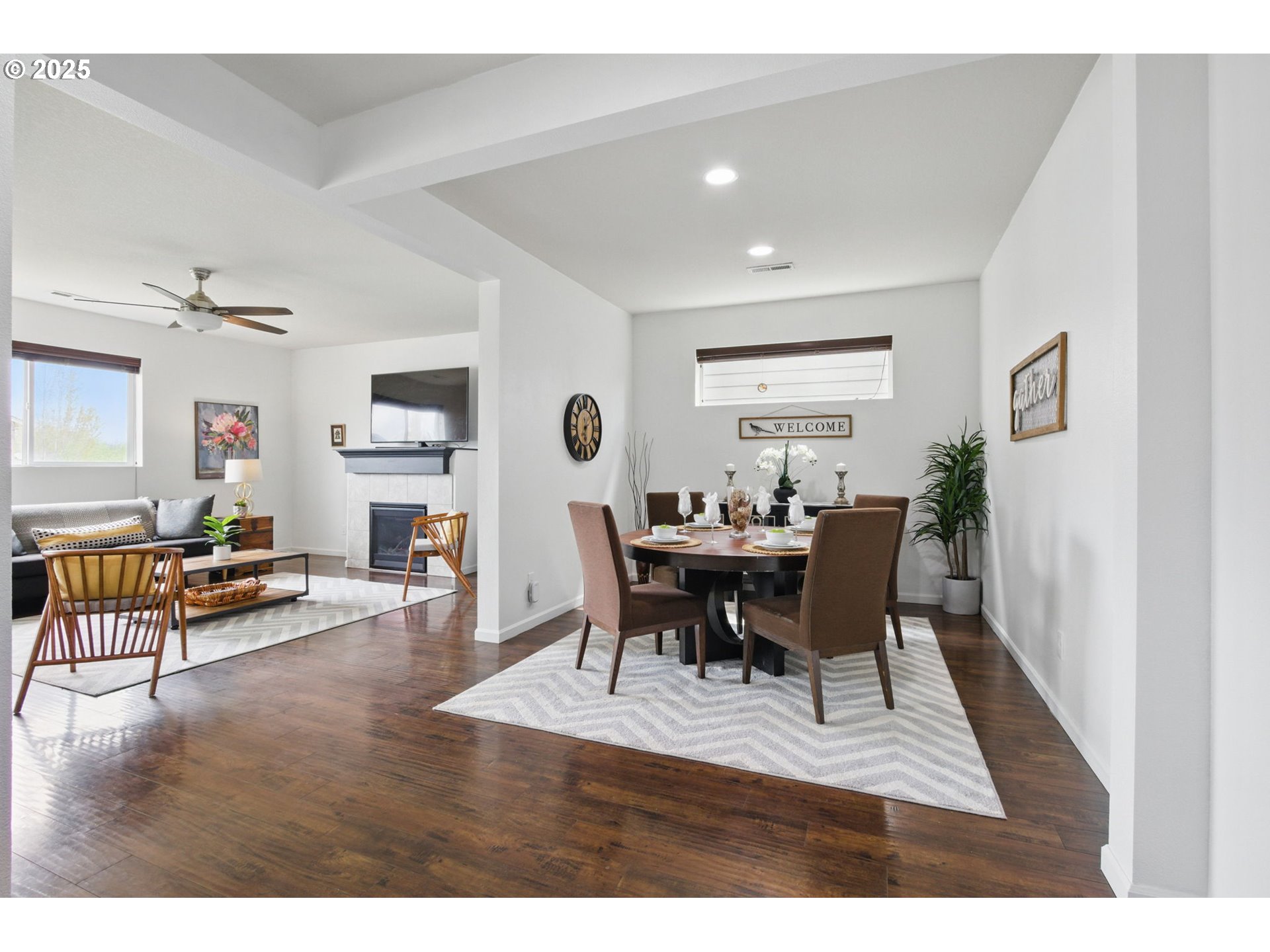 262 North 34th Court Ridgefield, WA 98642 - Photo 5 of 27 a view of a dining room with furniture and wooden floor