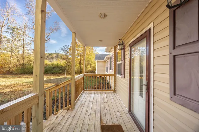 a view of a balcony with wooden floor