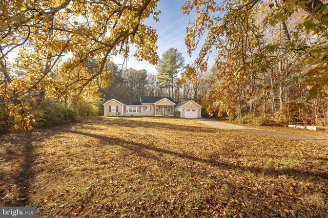 a front view of a house with a large windows