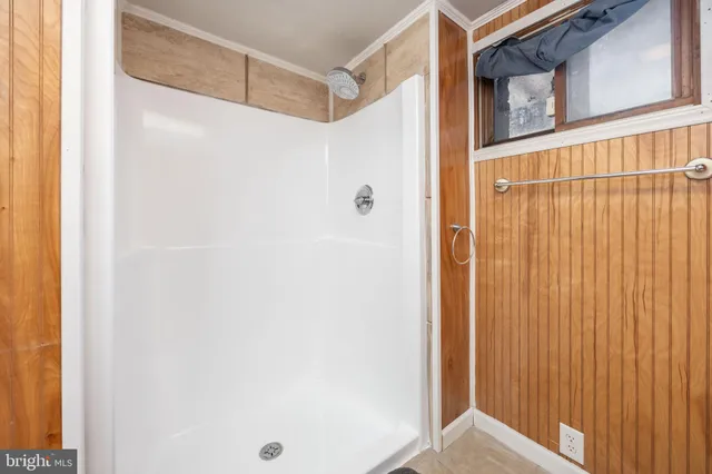 a bed room with a bed and a tv