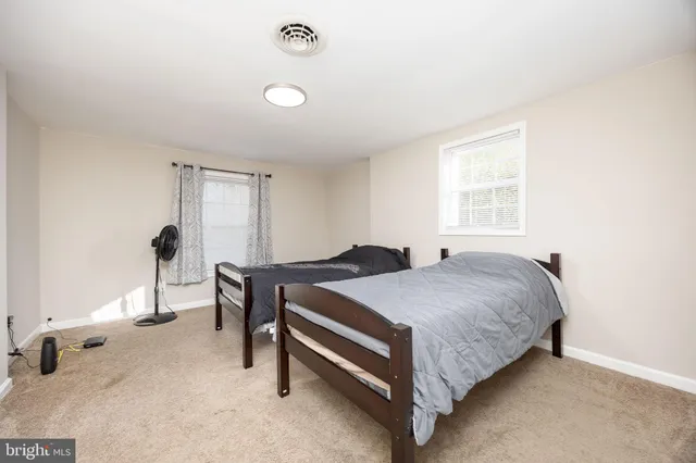 a bathroom with a toilet and a bathtub