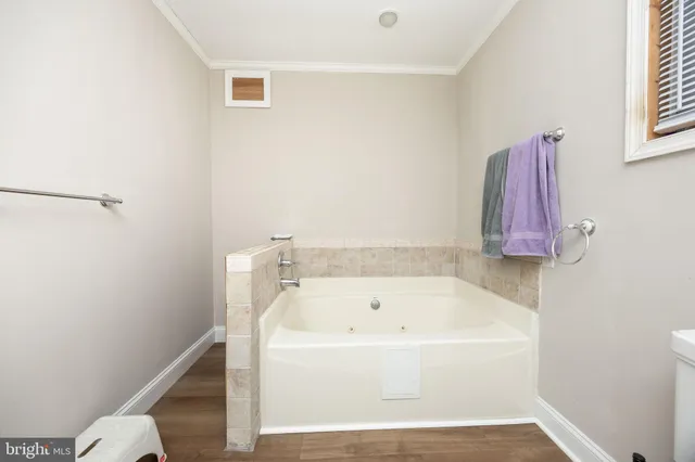 a view of balcony with wooden floor and fence