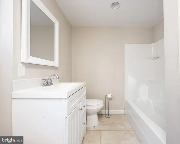 a view of a house with wooden deck