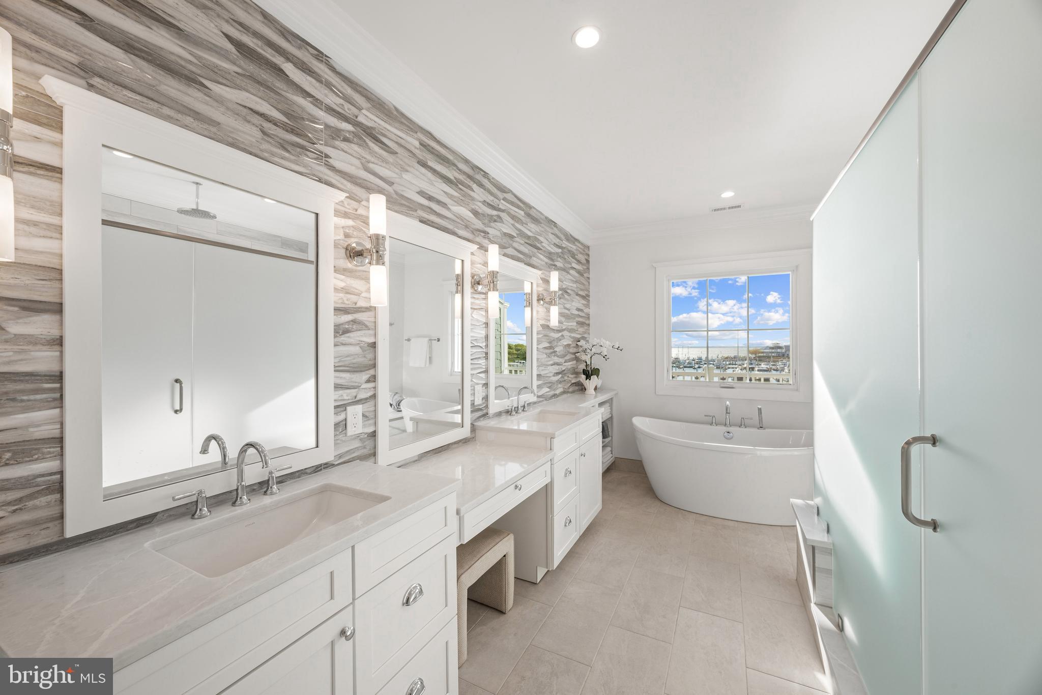 119 Petrie Way Stevensville, MD 21666 - Photo 21 of 45 a large white bathroom with a granite countertop tub sink and mirror