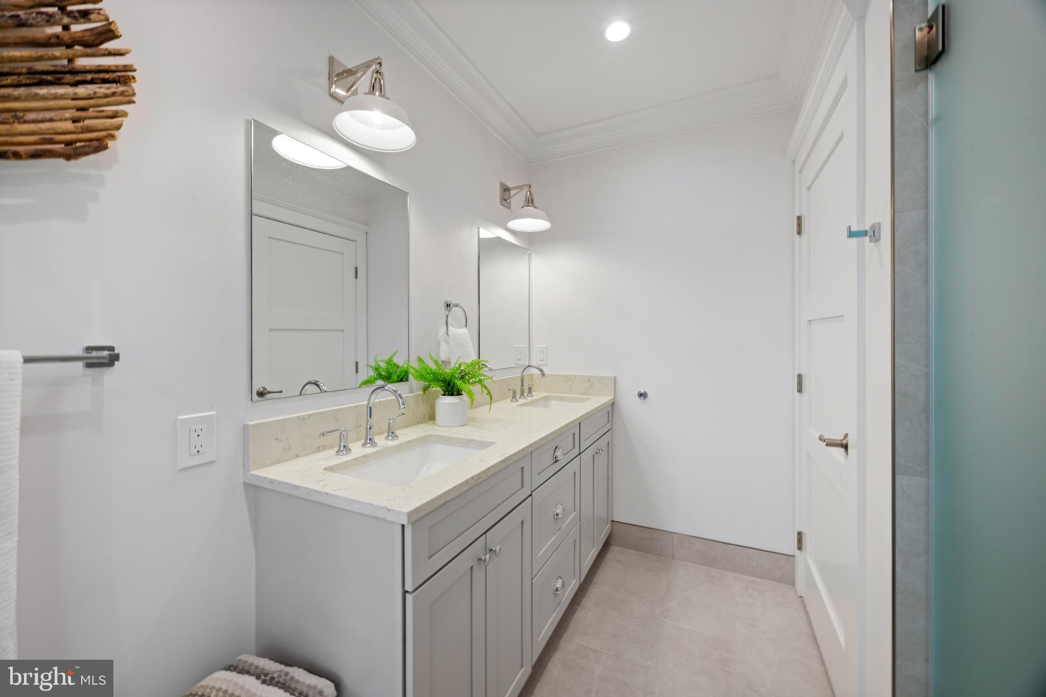 119 Petrie Way Stevensville, MD 21666 - Photo 35 of 45 a bathroom with a sink and a mirror