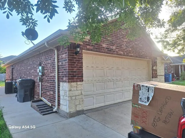 a view of pathway building and yard