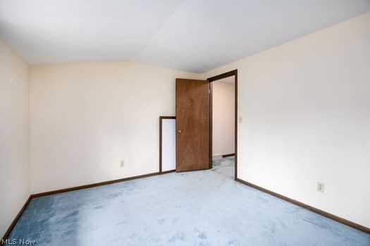 4293 Good Road Seville, OH 44273 - Photo 29 of 35 Empty room with lofted ceiling and carpet floors