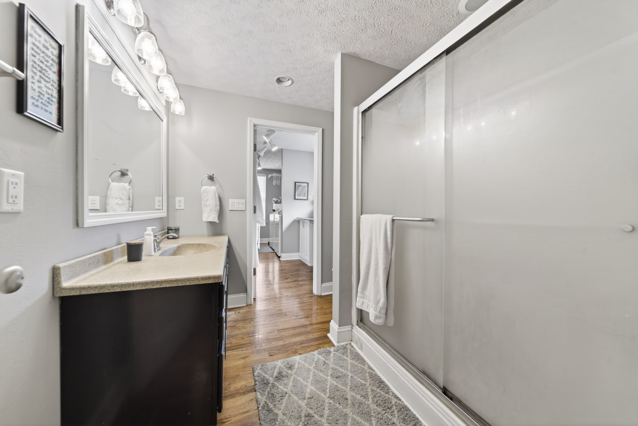 8023 Bethlehem Road Springfield, TN 37172 - Photo 40 of 55 a en suite bathroom with a sink a mirror and a shower
