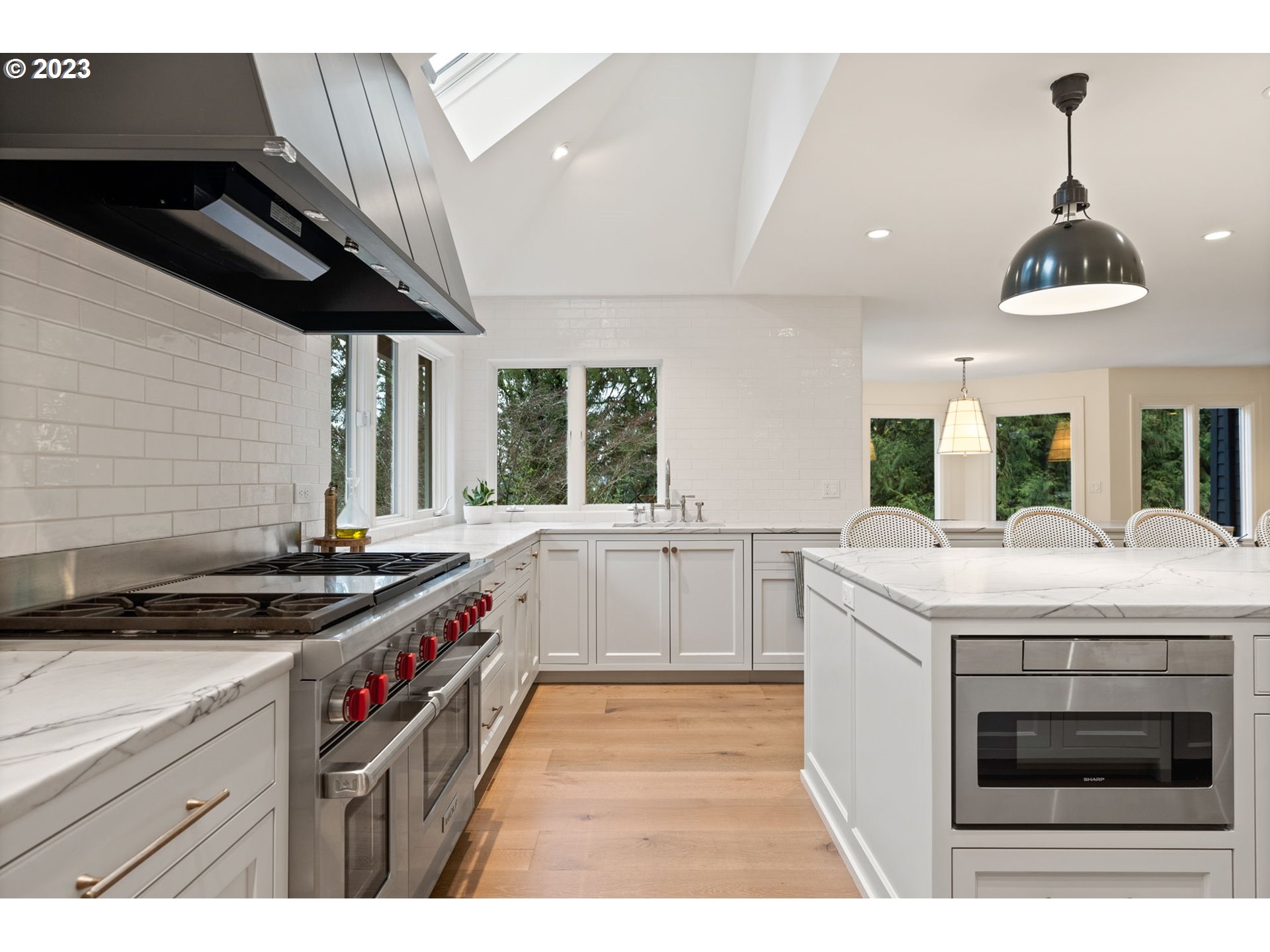 1991 South Palatine Hill Road Portland, OR 97219 - Photo 11 of 48 a kitchen with a stove and a white cabinets