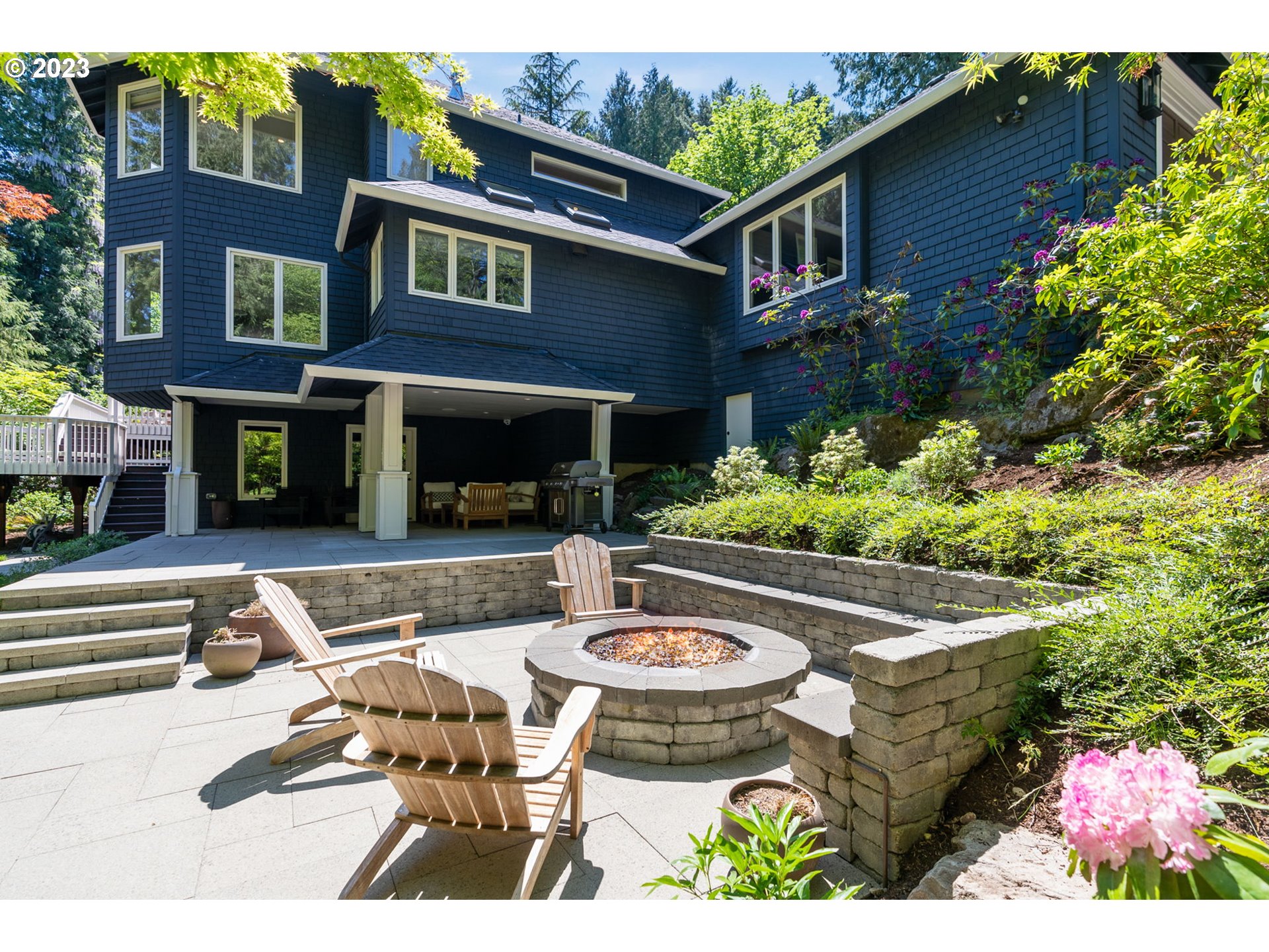 1991 South Palatine Hill Road Portland, OR 97219 - Photo 2 of 48 a view of a patio with table and chairs and potted plants