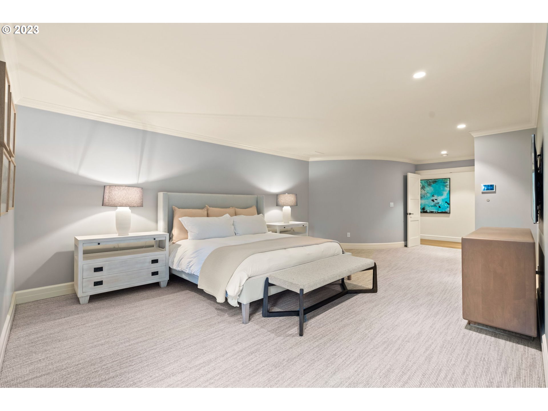 1991 South Palatine Hill Road Portland, OR 97219 - Photo 27 of 48 a spacious bedroom with a bed and a couch