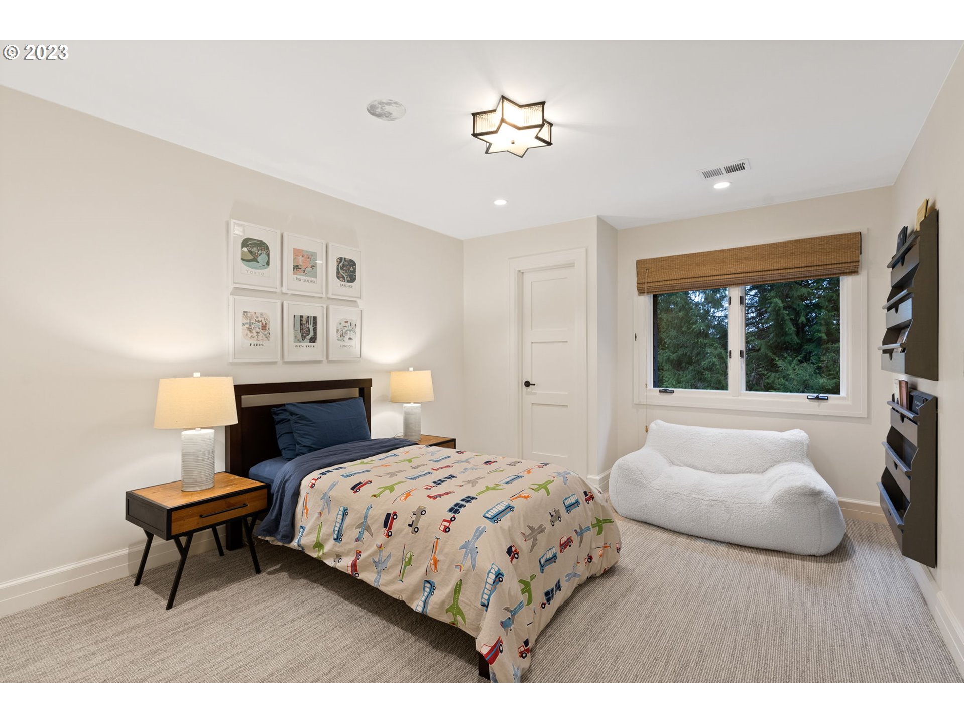 1991 South Palatine Hill Road Portland, OR 97219 - Photo 34 of 48 a bedroom with a bed and a chandelier