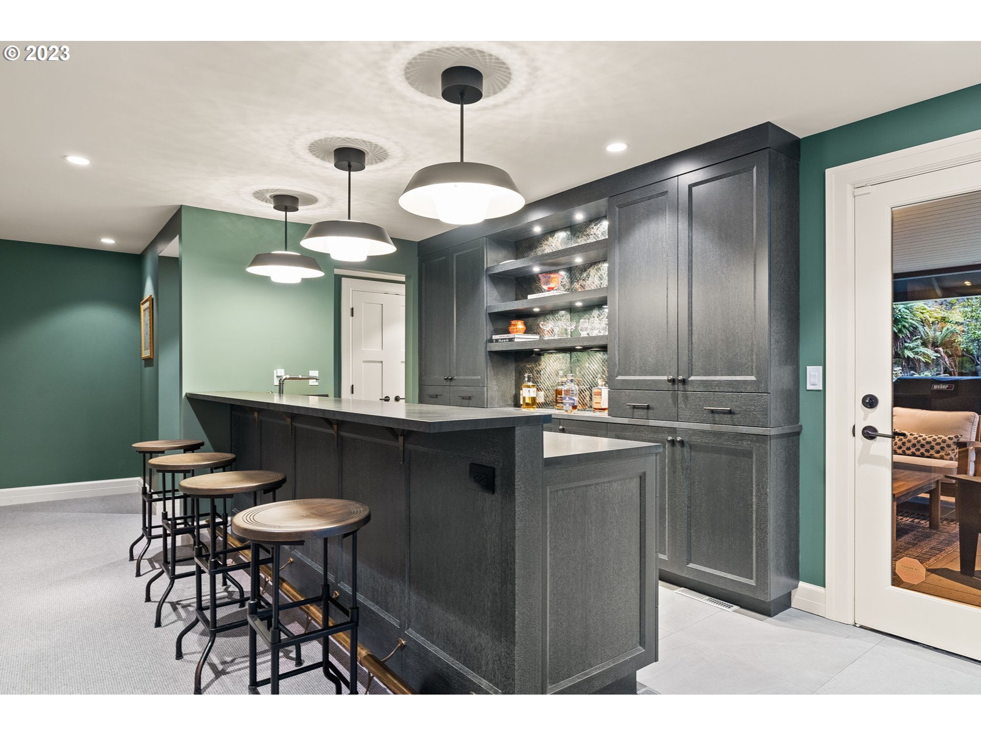1991 South Palatine Hill Road Portland, OR 97219 - Photo 38 of 48 a kitchen with stainless steel appliances kitchen island granite countertop a table and chairs in it
