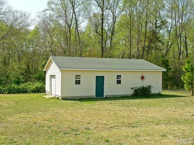 10829 Old Raleigh-Wilson Road Middlesex, NC 27557 - Photo 11 of 12 a backyard of a house with lots of green space