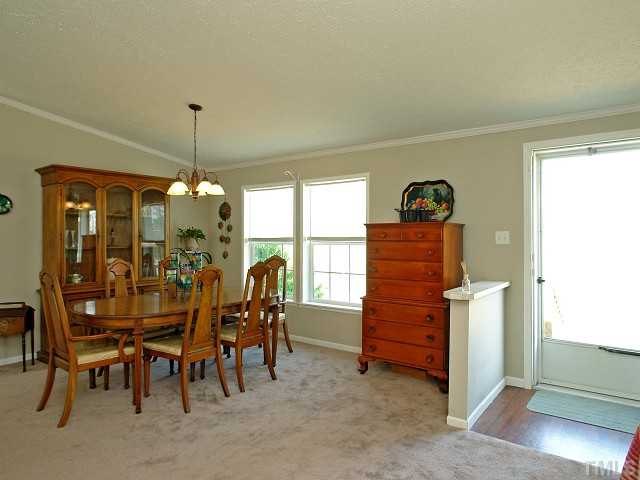 10829 Old Raleigh-Wilson Road Middlesex, NC 27557 - Photo 3 of 12 a view of a dining room with furniture window and outside view