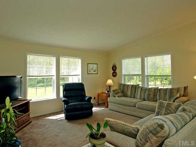10829 Old Raleigh-Wilson Road Middlesex, NC 27557 - Photo 4 of 12 a living room with furniture and a flat screen tv