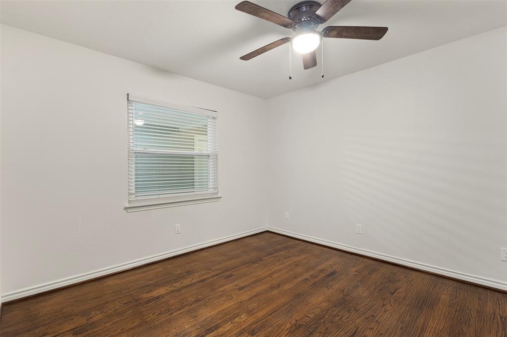 10879 Cassandra Way Dallas, TX 75228 - Photo 27 of 36 wooden floor in an empty room with a window